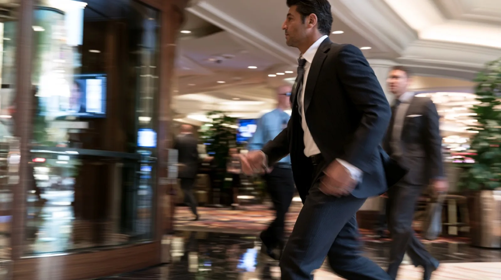 Man walking through a Nevada casino while facing potential restrictions related to the state’s excluded persons list.