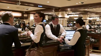 Casino employees processing financial transactions that may become part of the paper trail in a Nevada money laundering investigation.