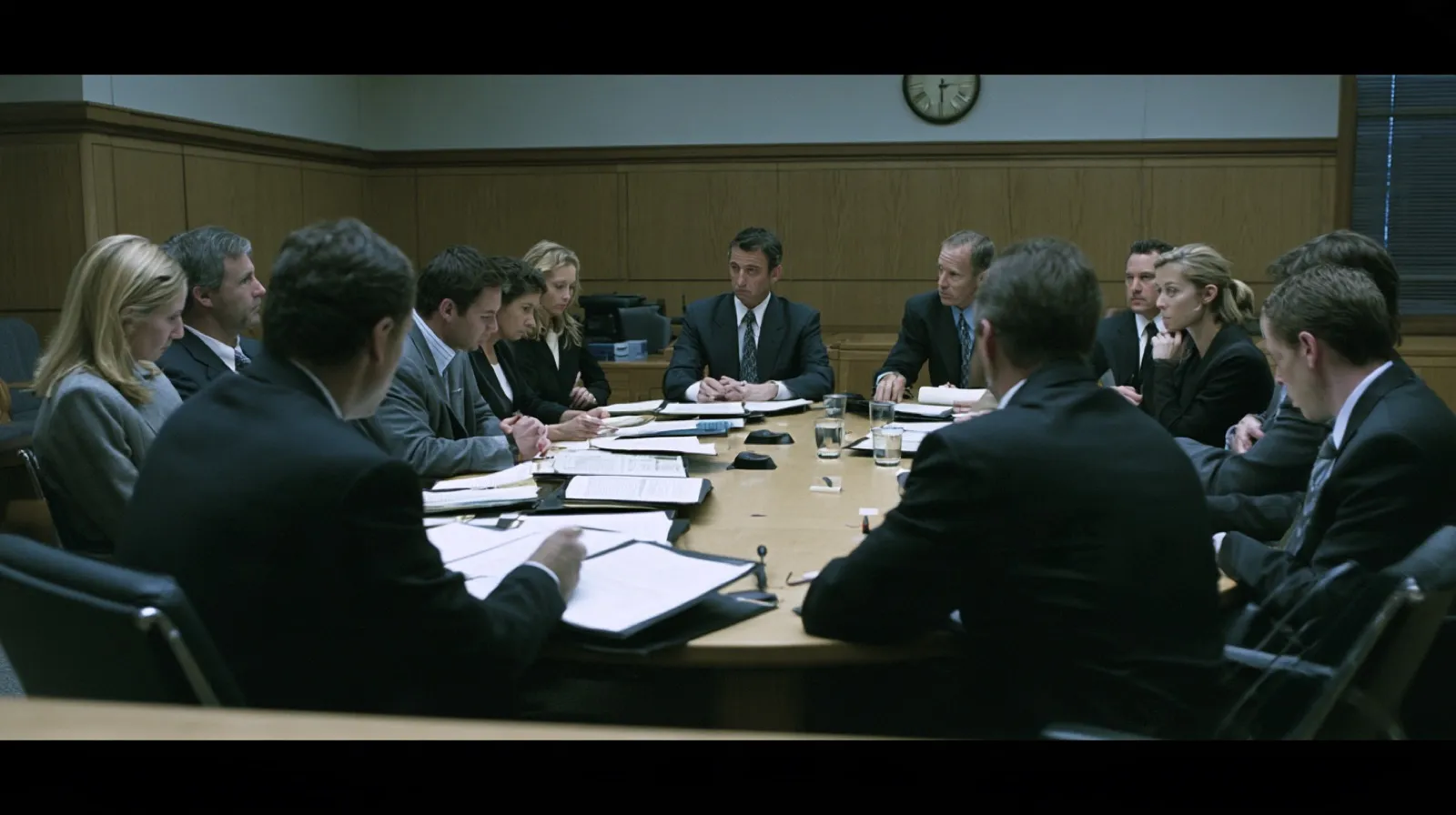 Jurors reviewing documents together during deliberations after hearing evidence in a Nevada criminal trial.