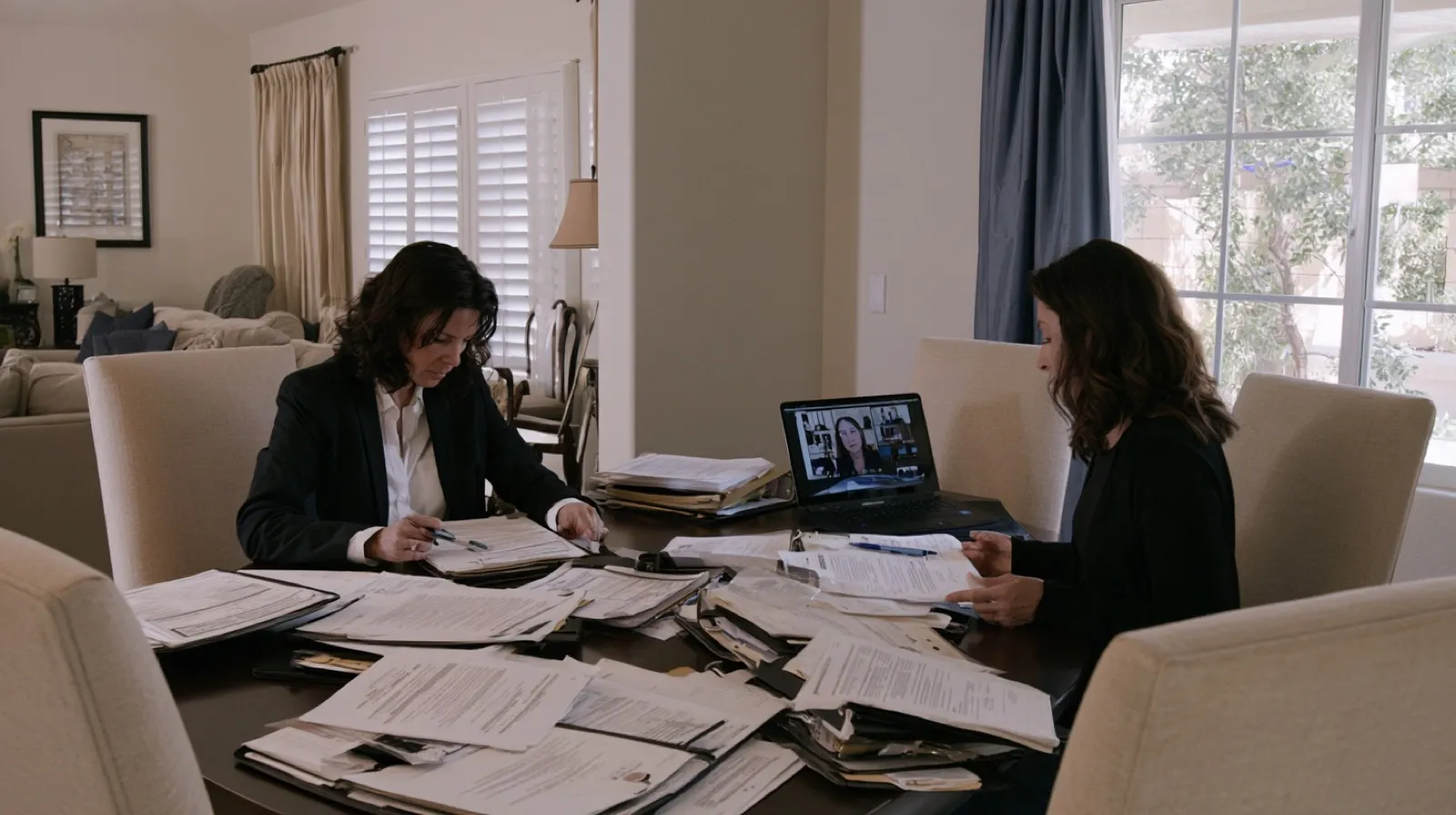 Legal professionals organizing case files and sentencing documents while preparing to review a Nevada presentence investigation report.