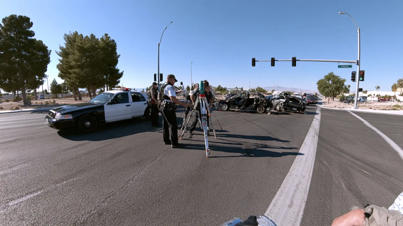 Law enforcement and crash reconstruction specialists examining the scene of a serious multi-vehicle collision in Nevada.