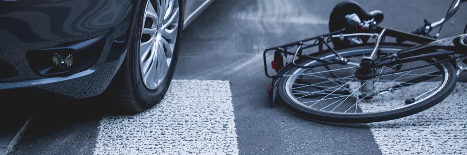 A bike lying on a street after accident