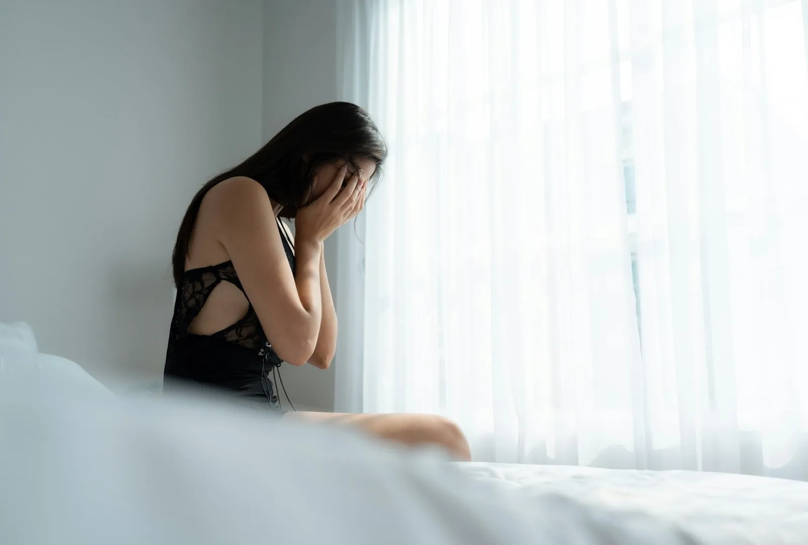 A young woman in a state of fear of assault from the angry man clenched his fists in to hit.