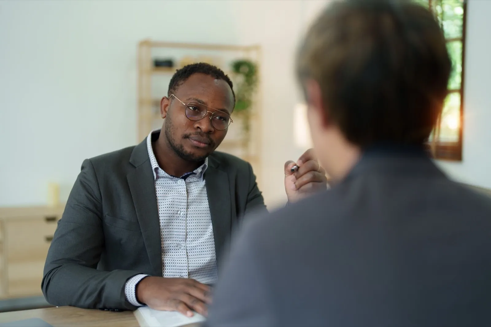 african american attorney, lawyers discussing contract or business agreement at law firm office, Bus