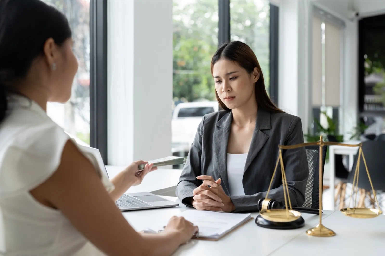 Attorney or officer accepts bribes from clients in the courtroom, takes bribes to gain an advantage