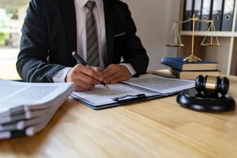 Attorney reading law code, studying constitution to protect human rights closeup, Male lawyer or jud
