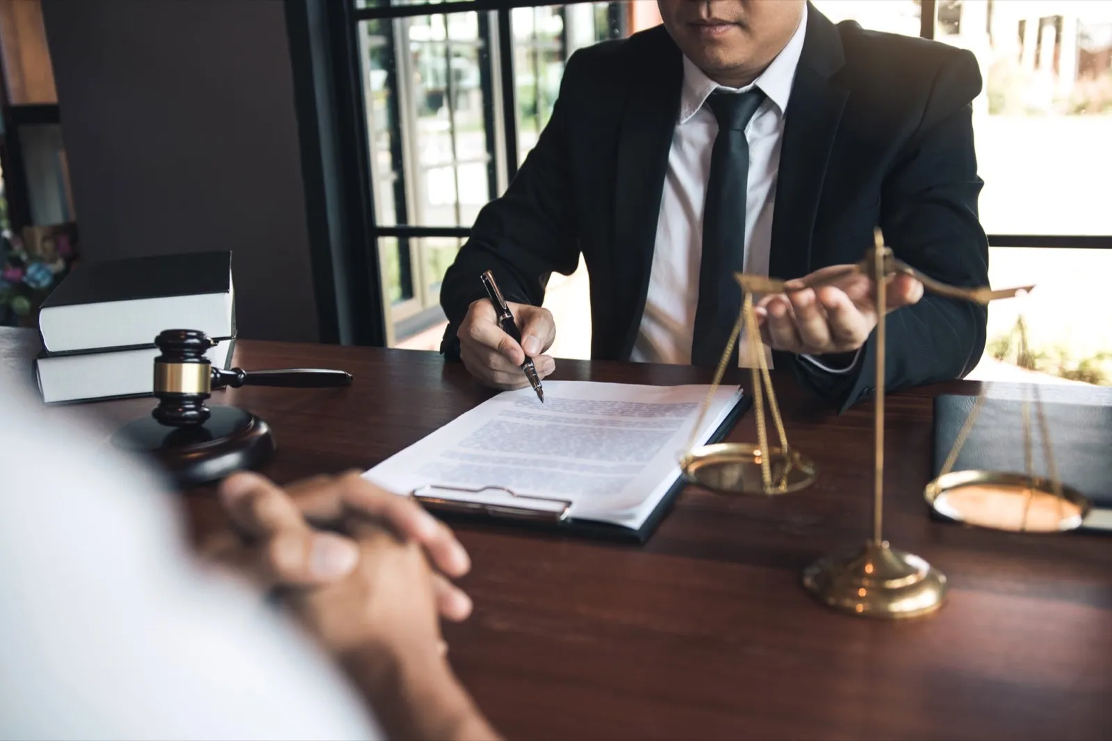 Business lawyer is currently counseling the client’s trial at the lawyer office.