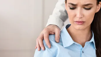 Businesswoman Victim Of Sexual Harassment Sitting In Office, Cropped