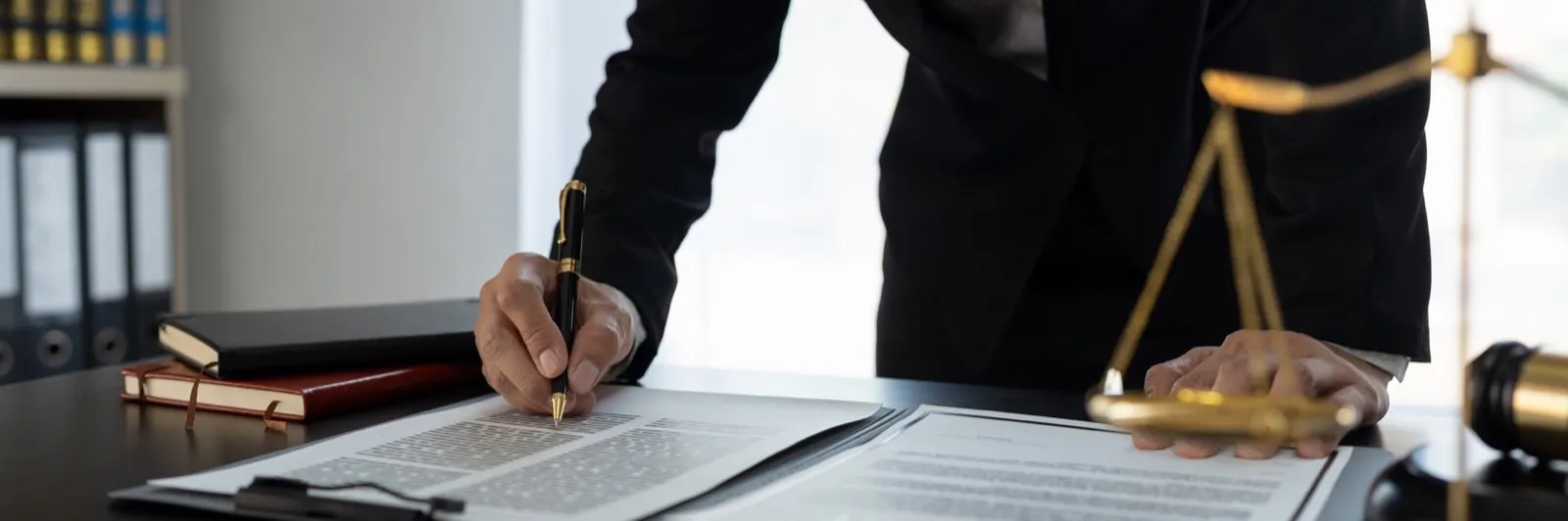 Confident lawyer or businessman examining details in real estate legal contract document Legal servi