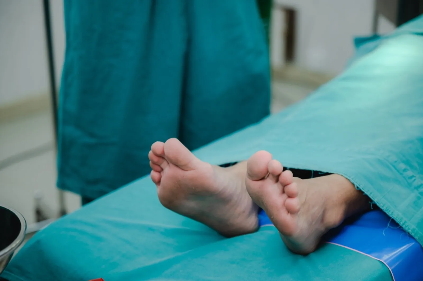 corpse foot on hospital table, health care medicine concept and life death insurance