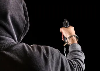 Dangerous prisoner fugitive with a Gun