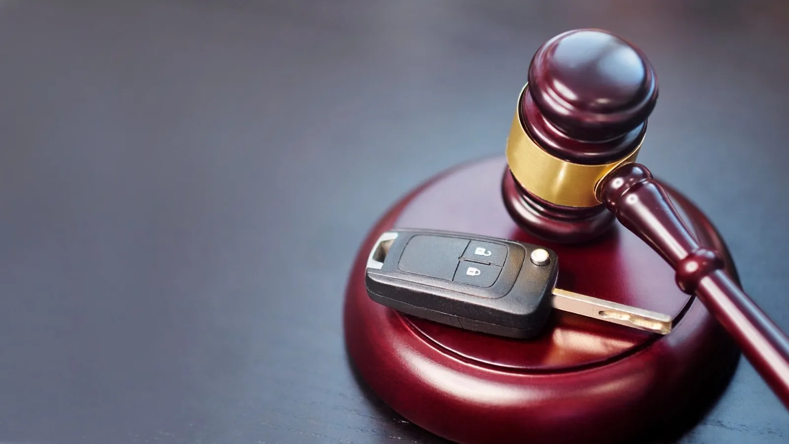 Driver license revocation concept next to the judge hammer.