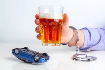 Drunk Driving Concept - Beer, Keys and Handcuffs