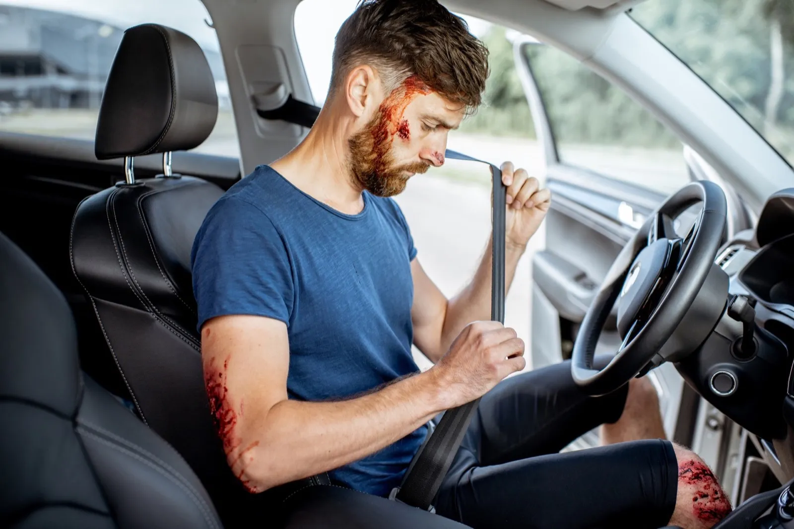 Fastened driver after the road accident