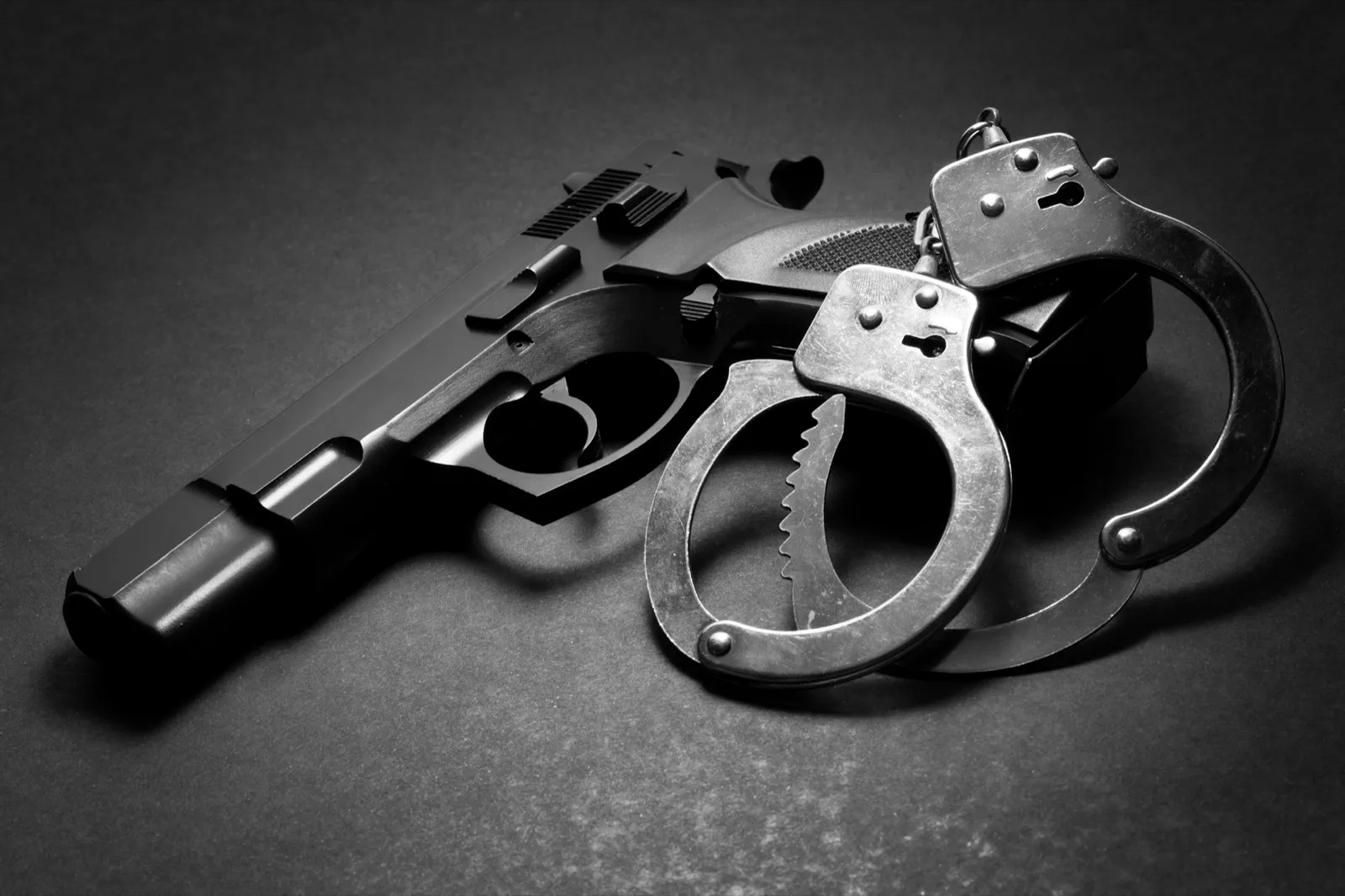 Handgun with handcuffs