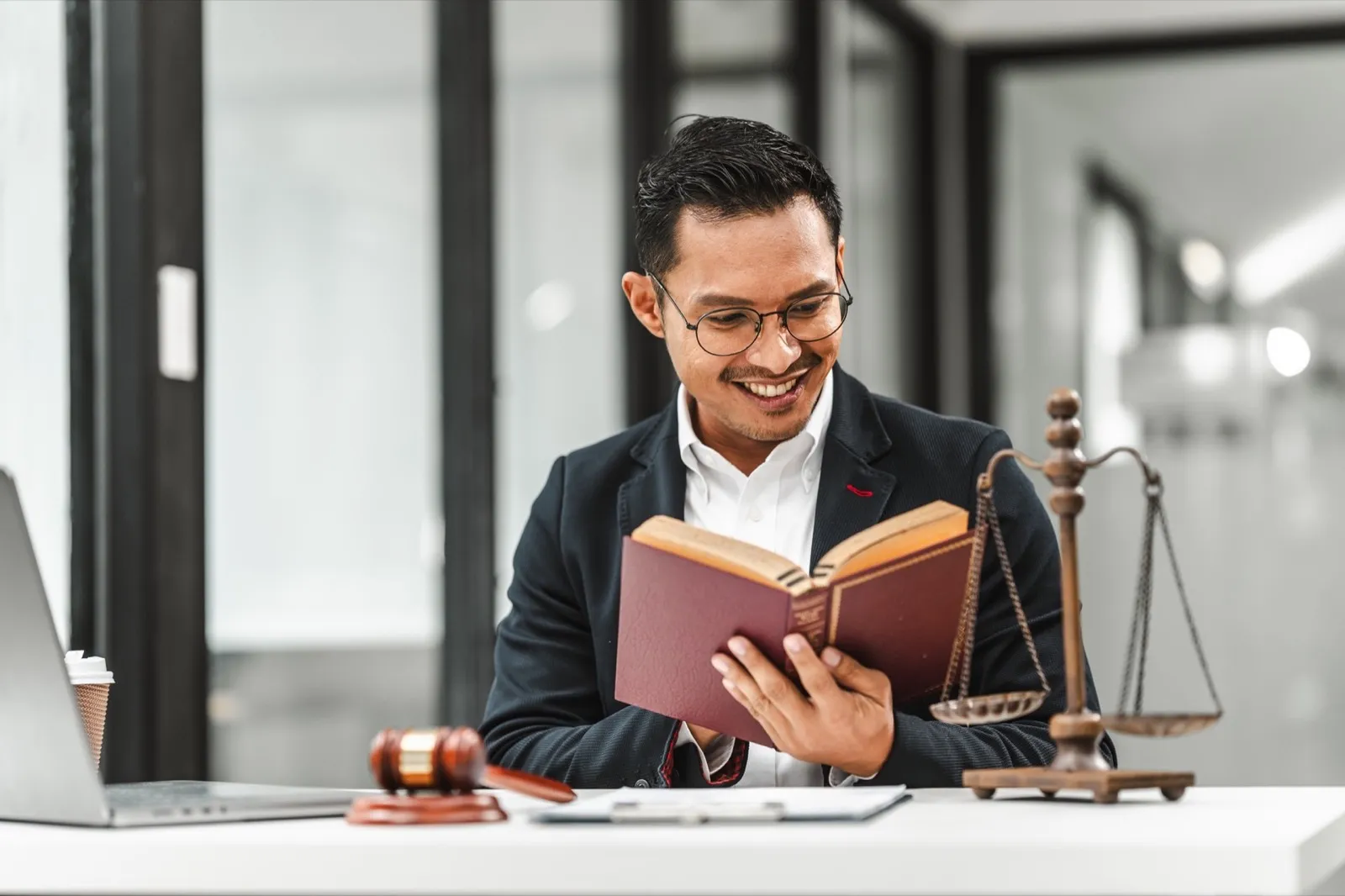 Handsome businessman lawyer of Indian descent. trusted litigation lawyers attorneys.