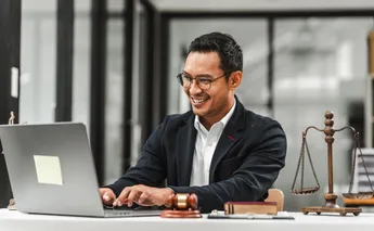 Handsome businessman lawyer of Indian descent. trusted litigation lawyers attorneys.