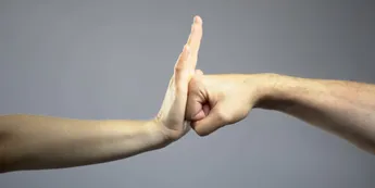 Woman rebuffing man, self-defense courses for women, stop domestic violence