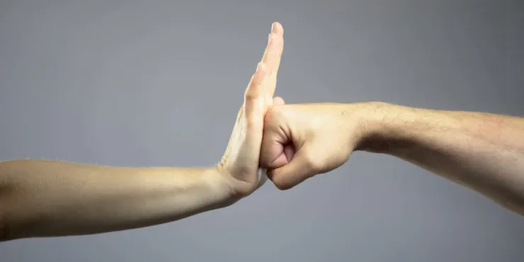 Woman rebuffing man, self-defense courses for women, stop domestic violence