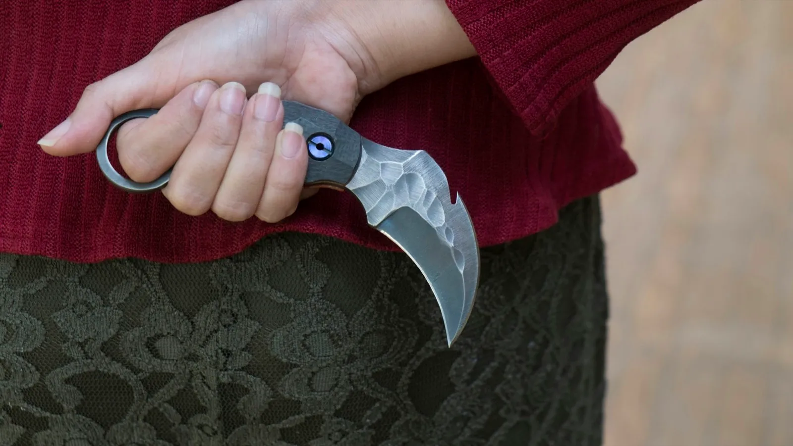 Knife in the hands, karambit knife tactical fighter, self defense Martial Arts Fighting