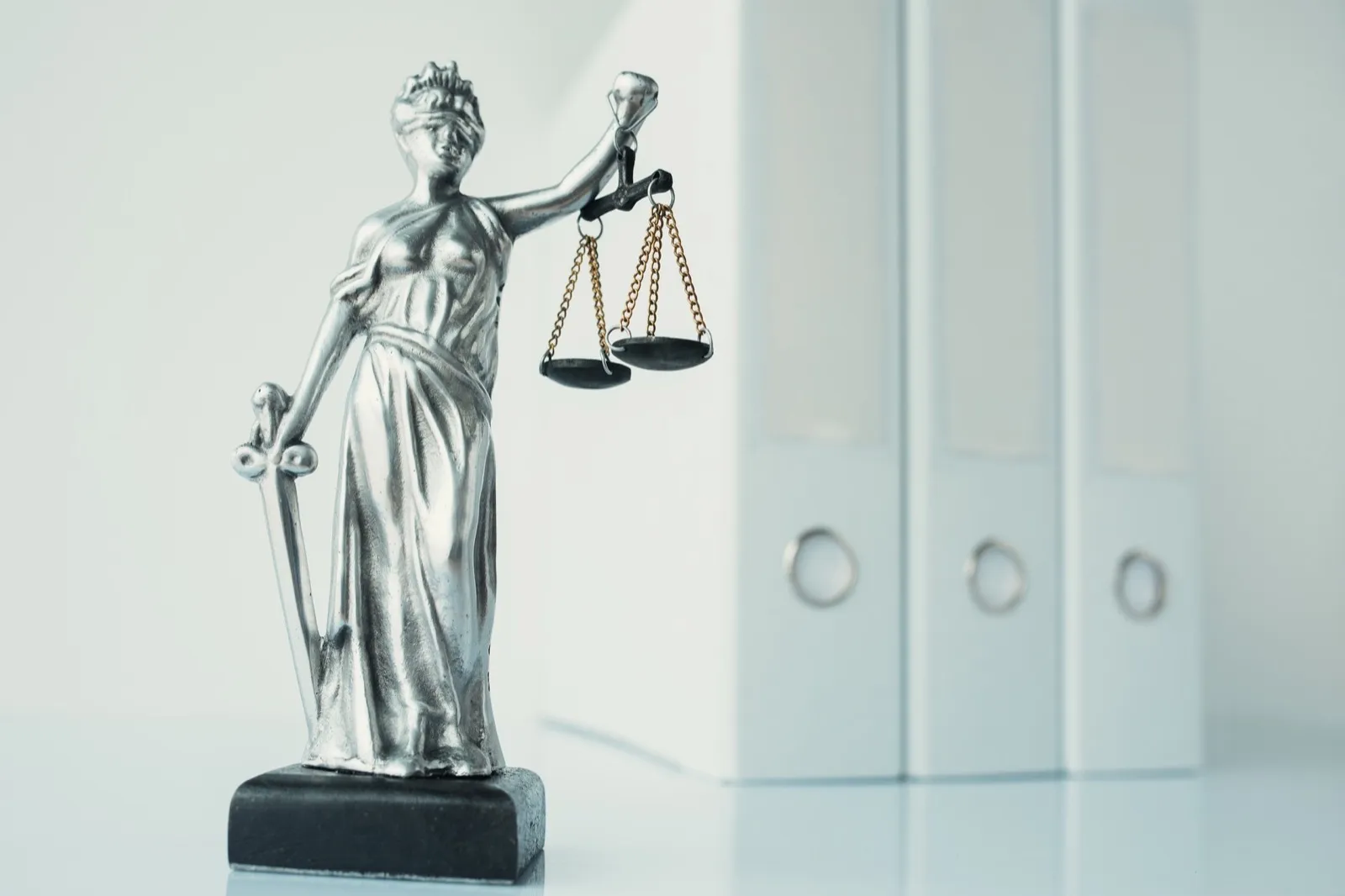 Lady Justice statue in law firm office