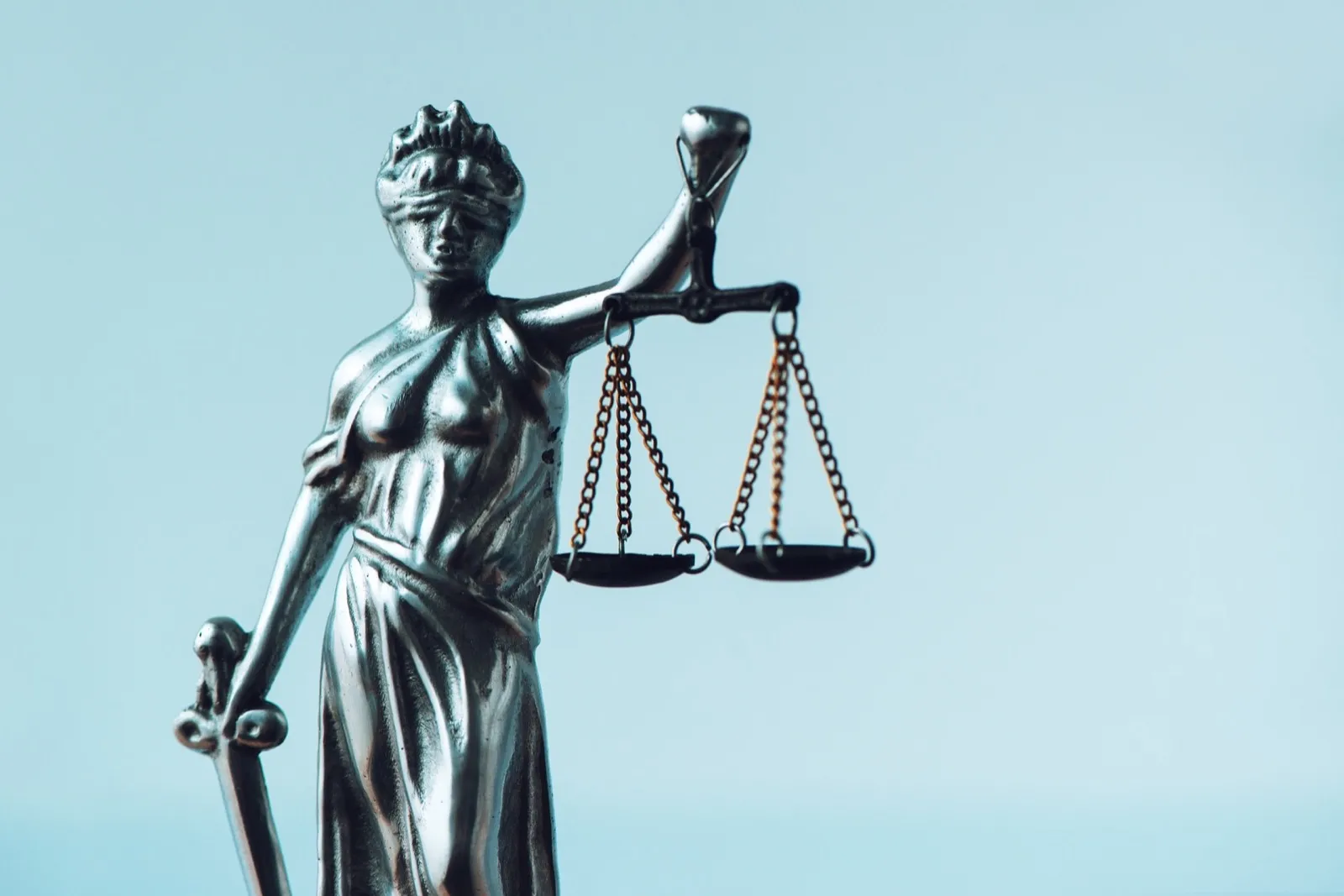 Lady Justice statue in law firm office