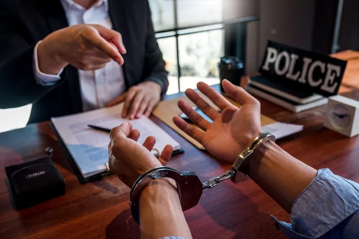 Law enforcement officer interrogating Criminals male