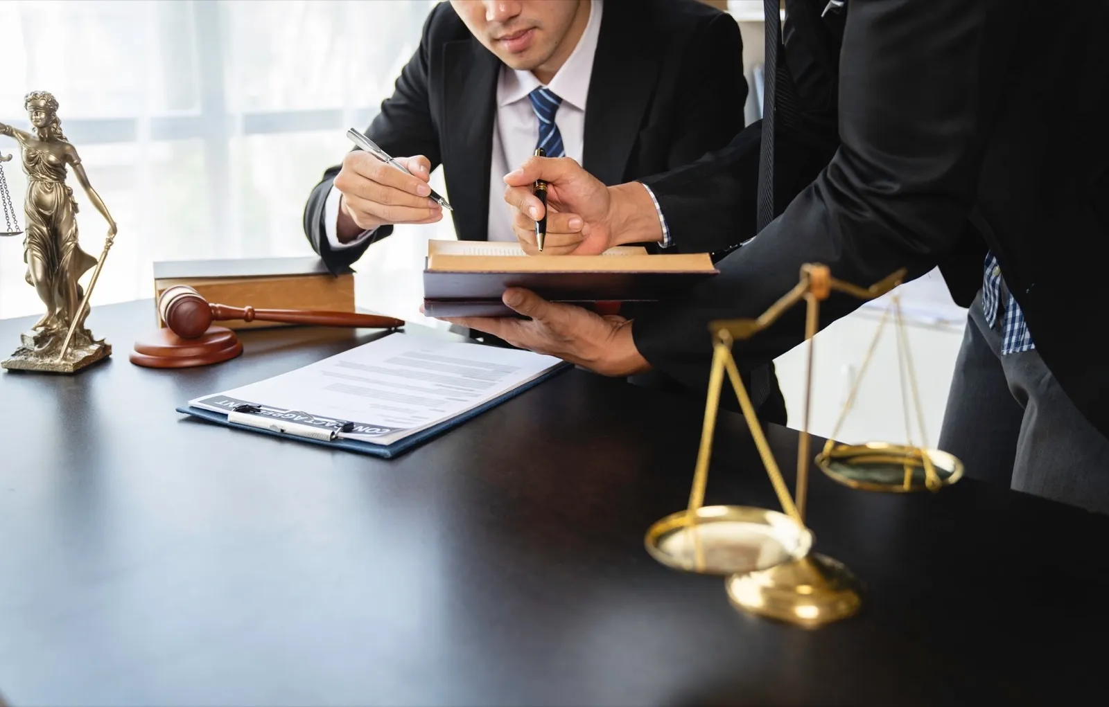 Lawyer or judge discussing legal matters in a client’s trial at a lawyer’s office, litigation consul