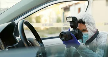 Man, forensics and photography in car at crime scene for hijacking, murder and investigation. Man,
