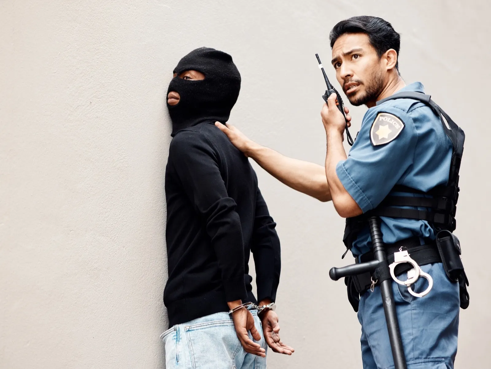 Man, police and walkie talkie with criminal for arrest, crime or justice in theft, robbery or viole