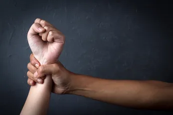 Man's Hand Holding A Woman Hand, Sexual Abuse And Rape Concept