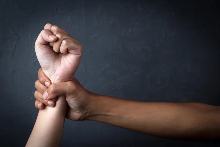 Man's Hand Holding A Woman Hand, Sexual Abuse And Rape Concept