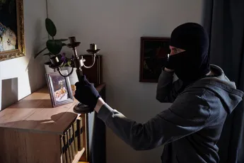 Masked Man Stealing Candlestick during Burglary