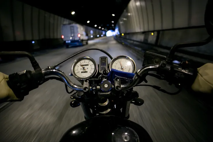 POV motorcycle driver on empty road
