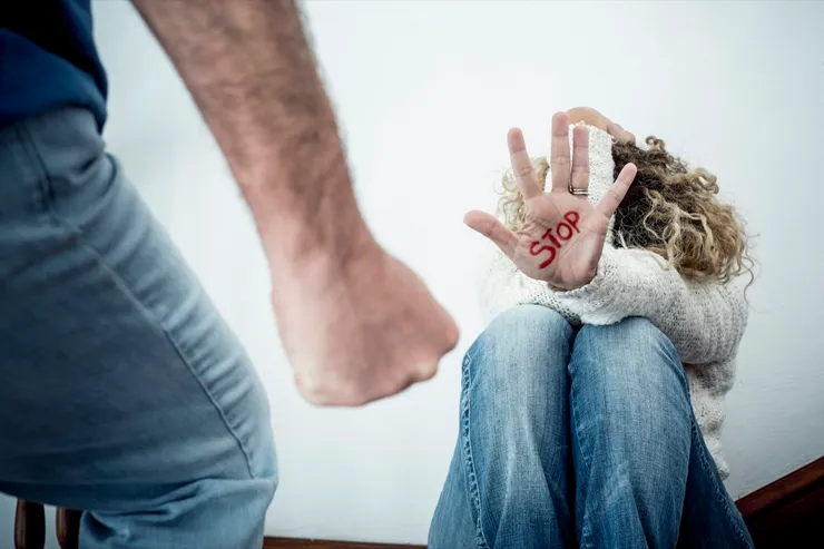 Stop Domestic violence aggression concept with hidden woman protecting herself