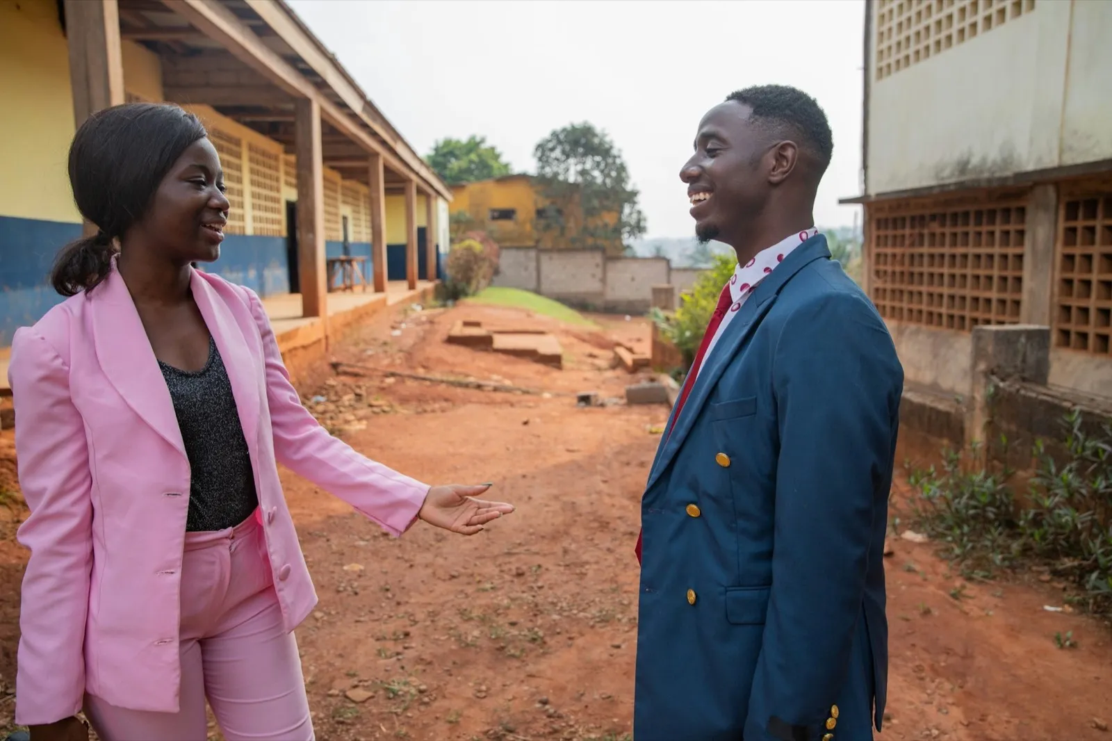 Two colleagues, female and male are having a discussion at work in Africa
