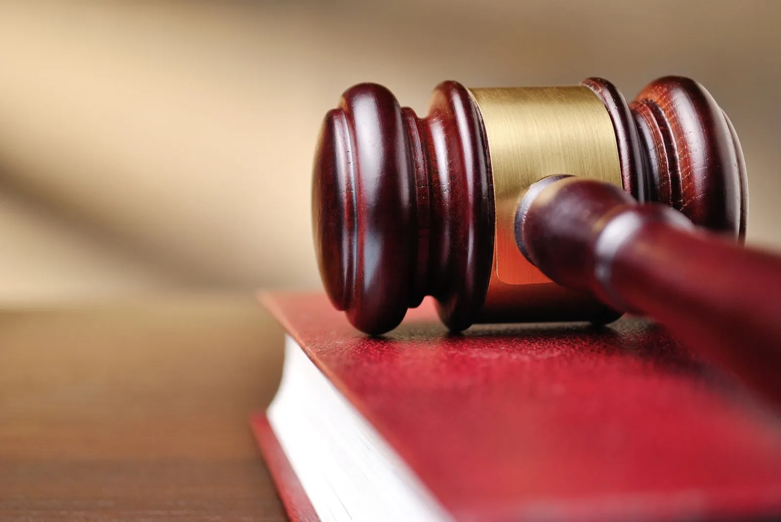 Wooden judges gavel on a law book